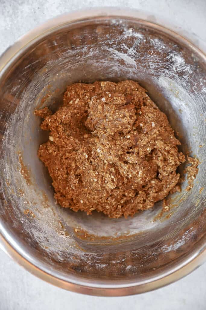 overhead photo of the cookie dough in a stainless steel bowl.