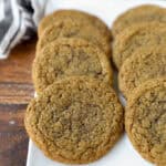 thin oatmeal cookies on a white platter.