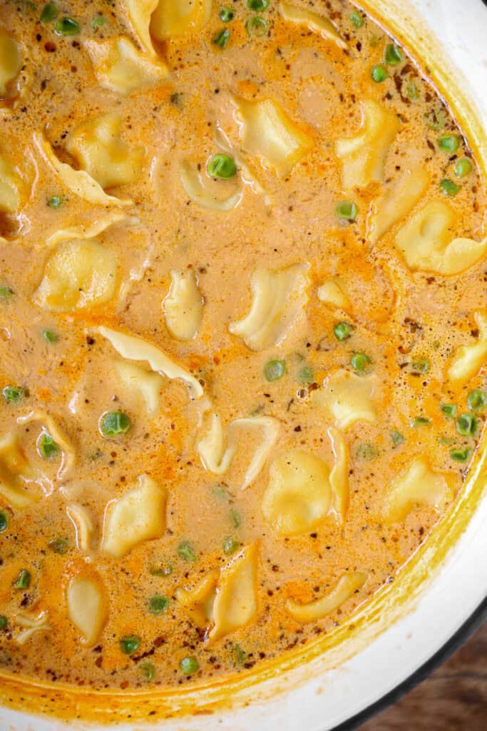 overhead photo of tortellini soup the Dutch oven.